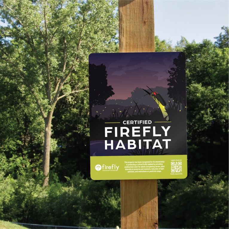 Image showing a certified firefly habitat sign on a wood post outside